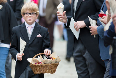 pageboy holding a basket of confetti
